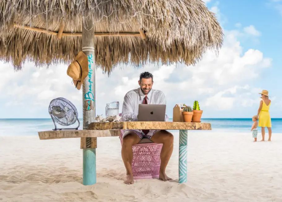 a man working on the beach in half formal and half informal way