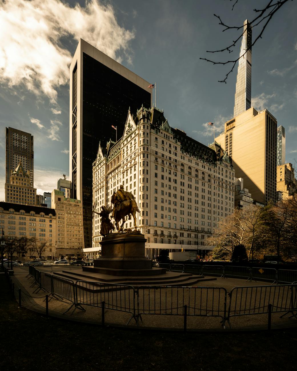 Home The Plaza Hotel amidst New York City's skyline at daytime, capturing a blend of historic and modern architecture.